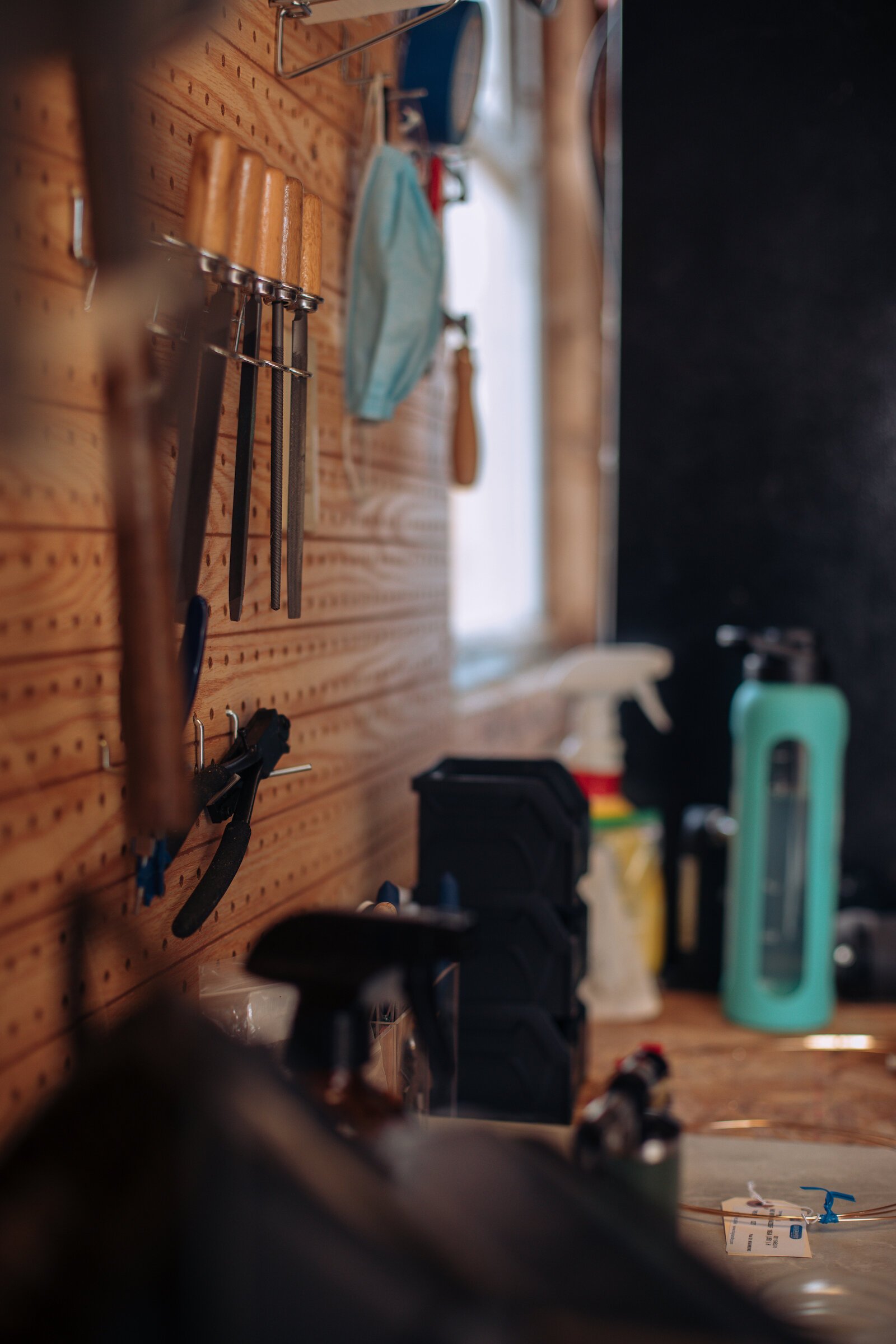 Tools for jewelry making at the workspace of Raelyn Bever, owner of Still Remains Jewelry.