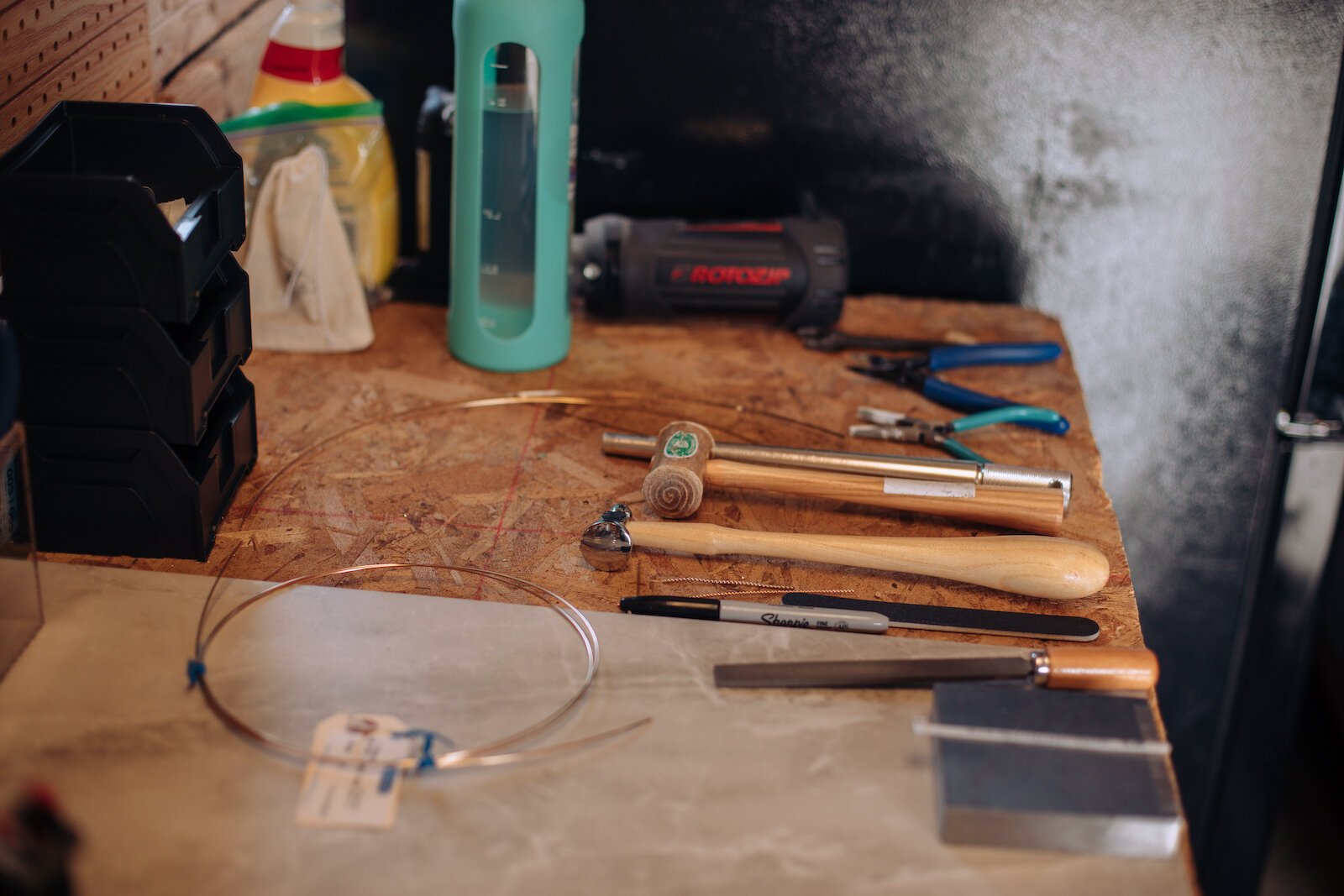 Tools for jewelry making at the workspace of Raelyn Bever, owner of Still Remains Jewelry.