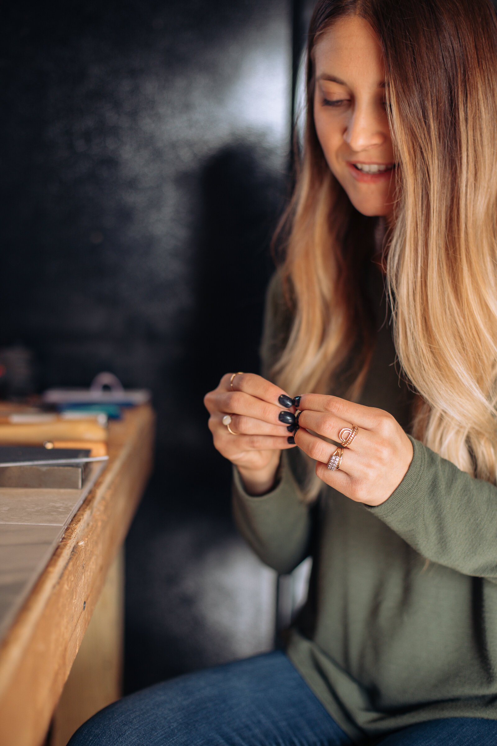 Still Remains Owner Raelyn Bever works on a ring in her garage workspace.