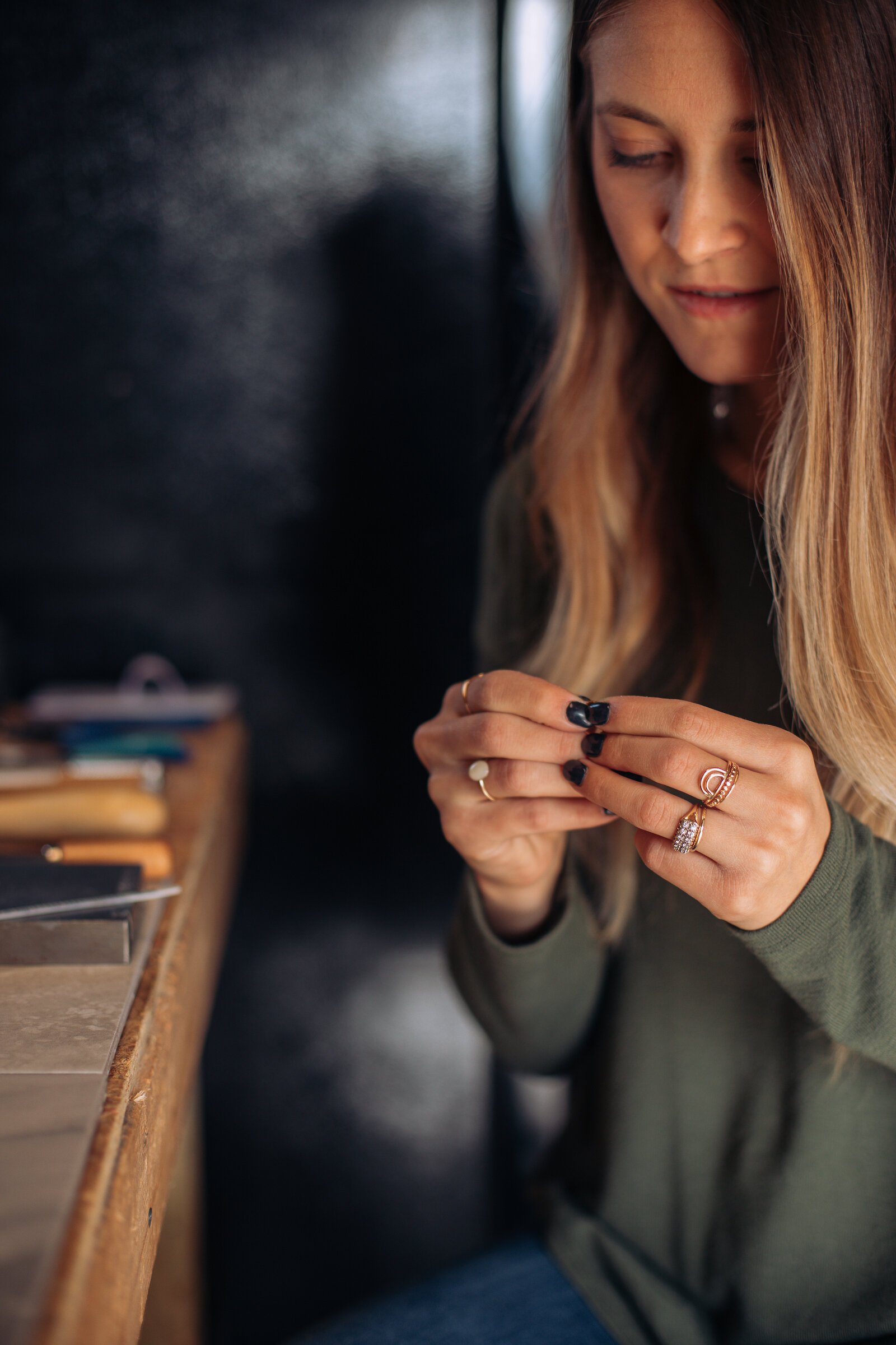 Still Remains Owner Raelyn Bever works on a ring in her garage workspace.