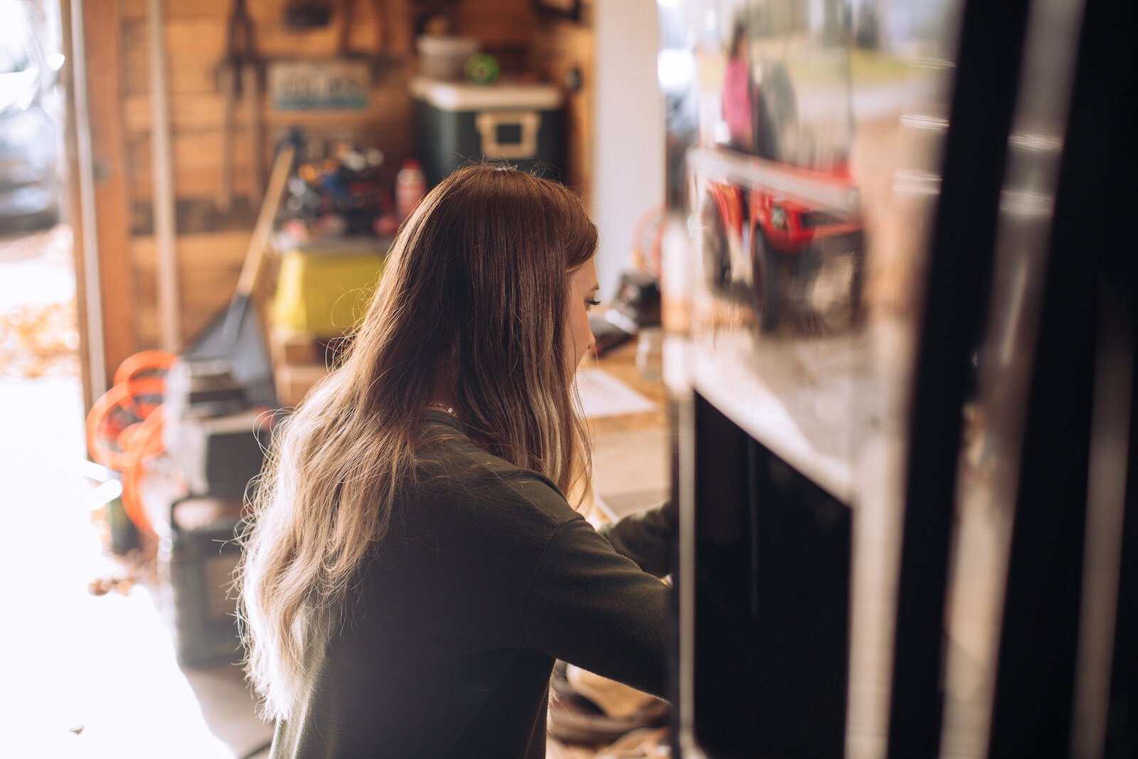 Still Remains Owner Raelyn Bever works on a ring in her garage workspace.