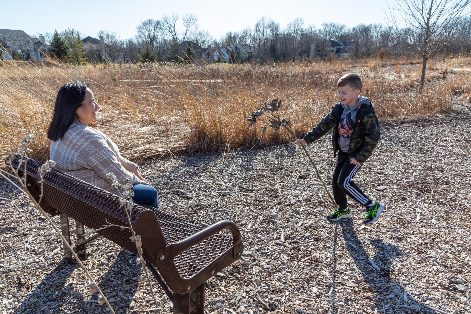 Families explore the prairie outside of Stillwater Hospice.