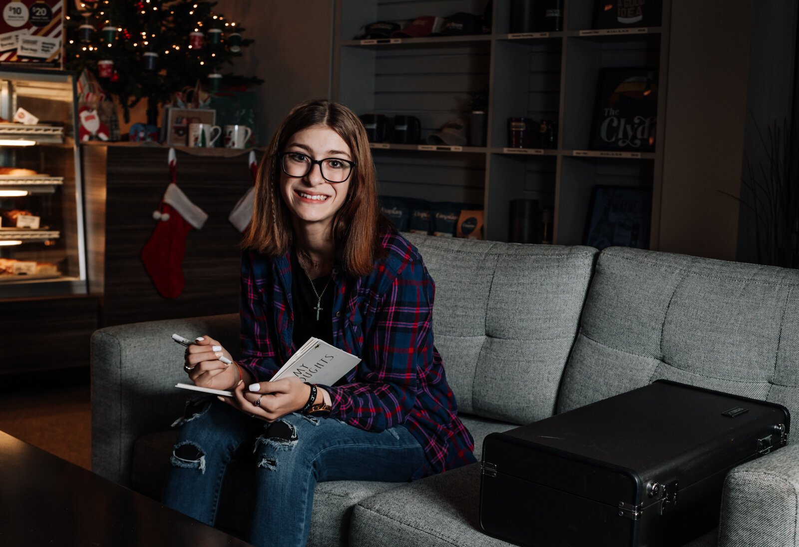 Amara Marion, an eighth grader at Memorial Park, writes songs for piano while at Crescendo Coffee & More.