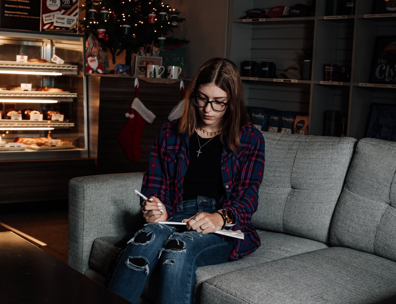 Amara Marion, an eighth grader at Memorial Park, writes songs for piano while at Crescendo Coffee & More.