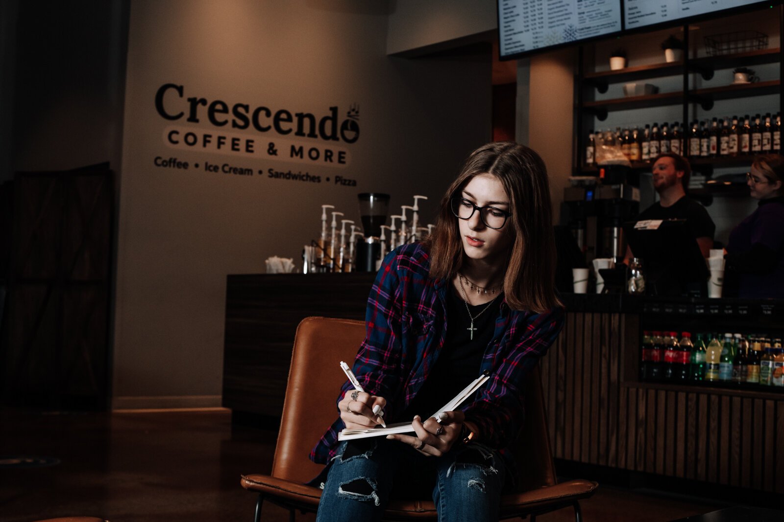 Amara Marion, an eighth grader at Memorial Park, writes songs for piano while at Crescendo Coffee & More.