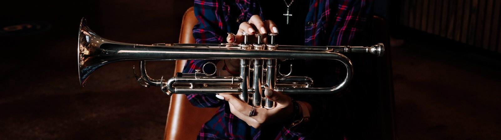 Amara Marion, an eighth grader at Memorial Park, poses with her trumpet at a hotspot for local music in Fort Wayne, Crescendo Coffee & More.