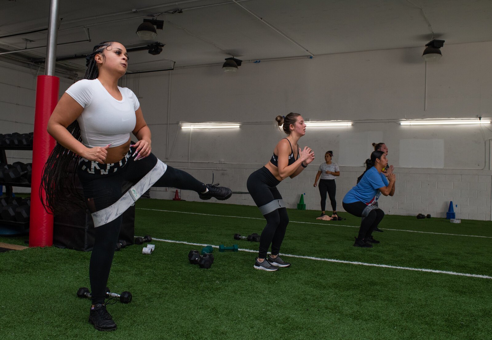 Arica Rencher, left, participates in one of Tori Leigh Fitness's small group workout classes.