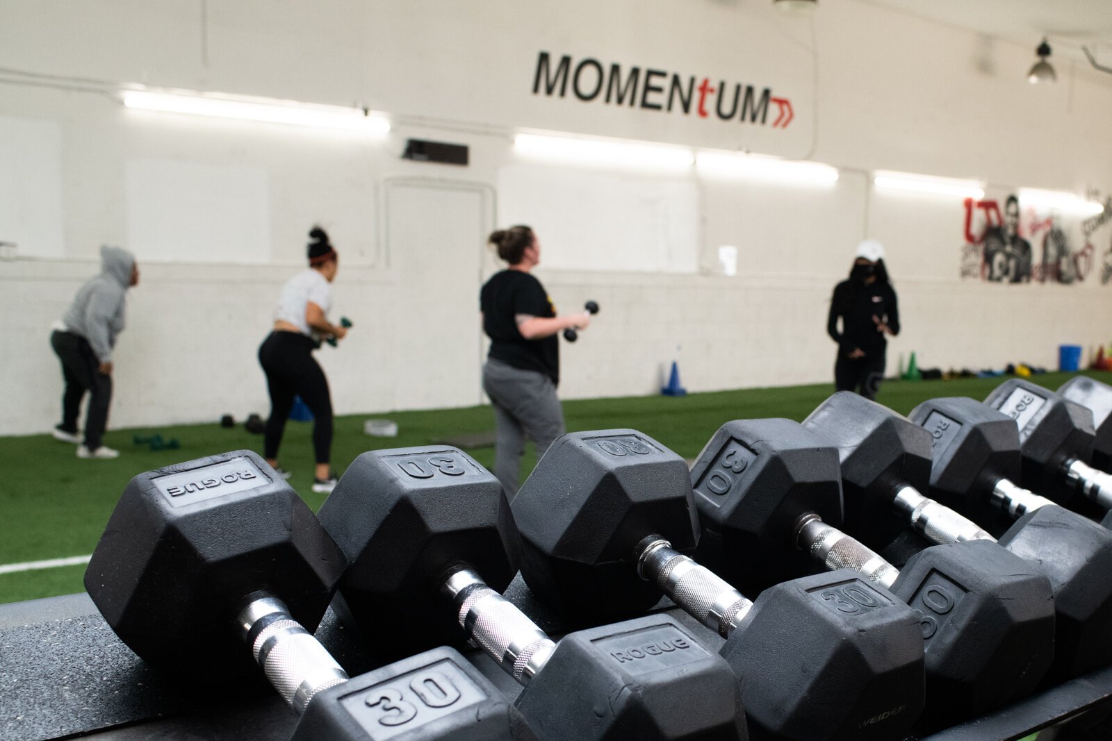 Victoria "Tori" Soto's of Tori Leigh Fitness leads an exercise during a small group workout class.