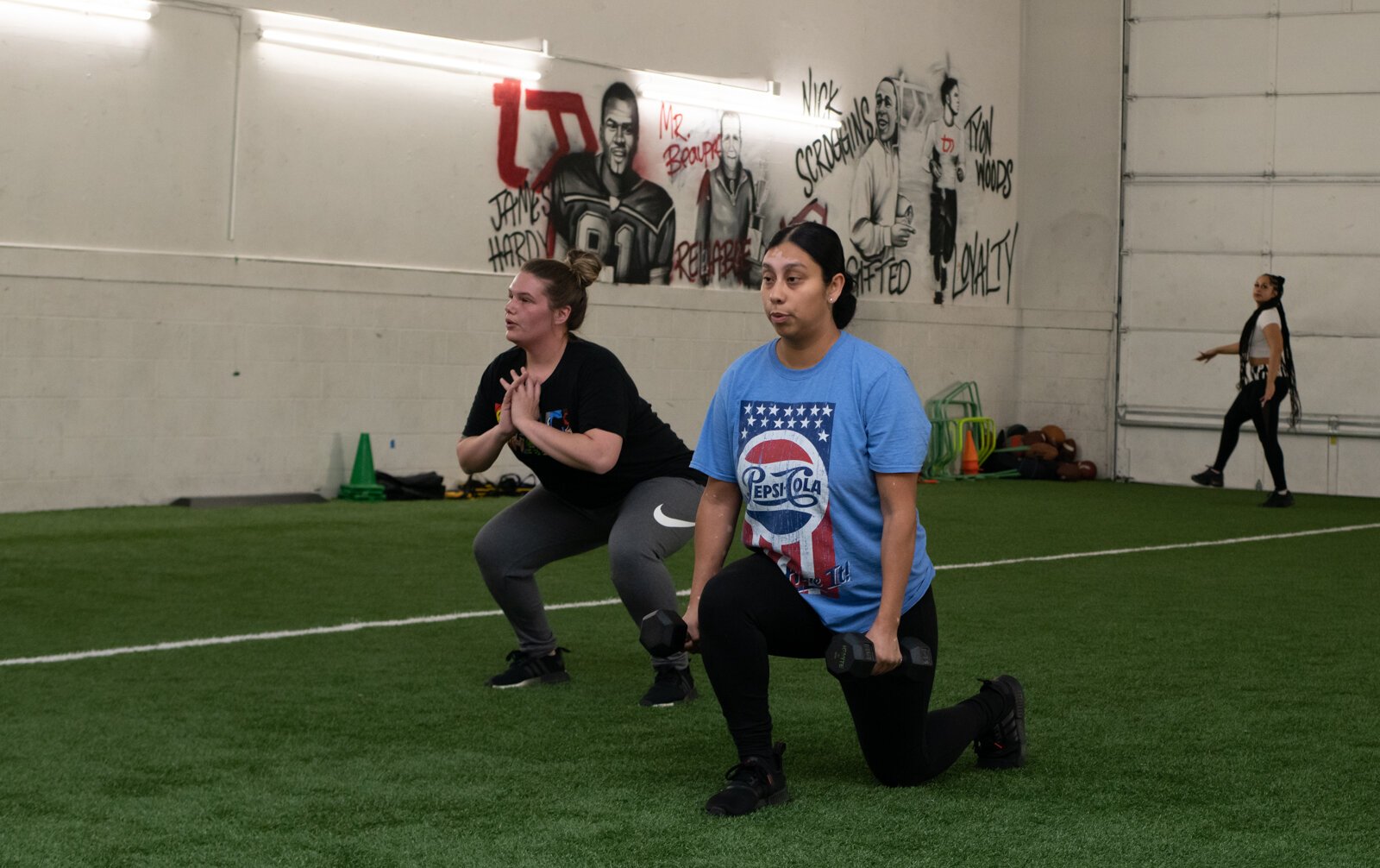 Veronica Ochoa, right, and Kaytlin Callaway exercise in one of Tori Leigh Soto's small group workout classes.