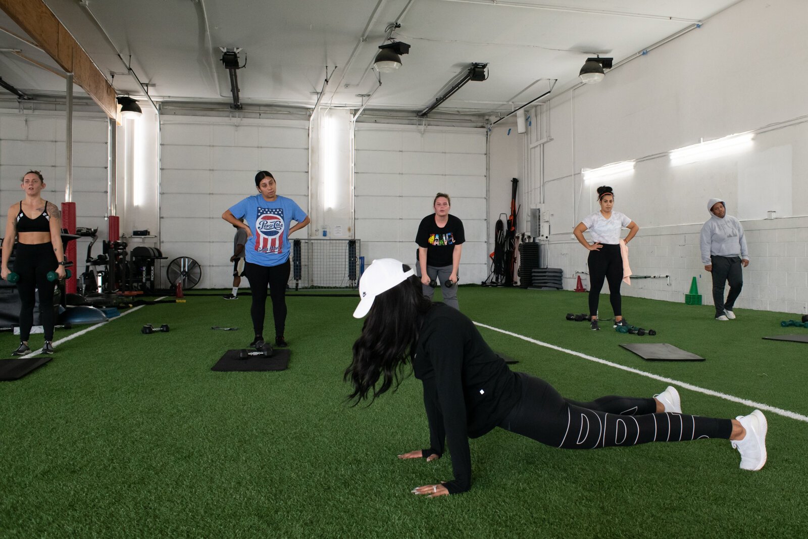 Victoria "Tori" Soto's of Tori Leigh Fitness demonstrates an exercise during one of her small group workout classes.