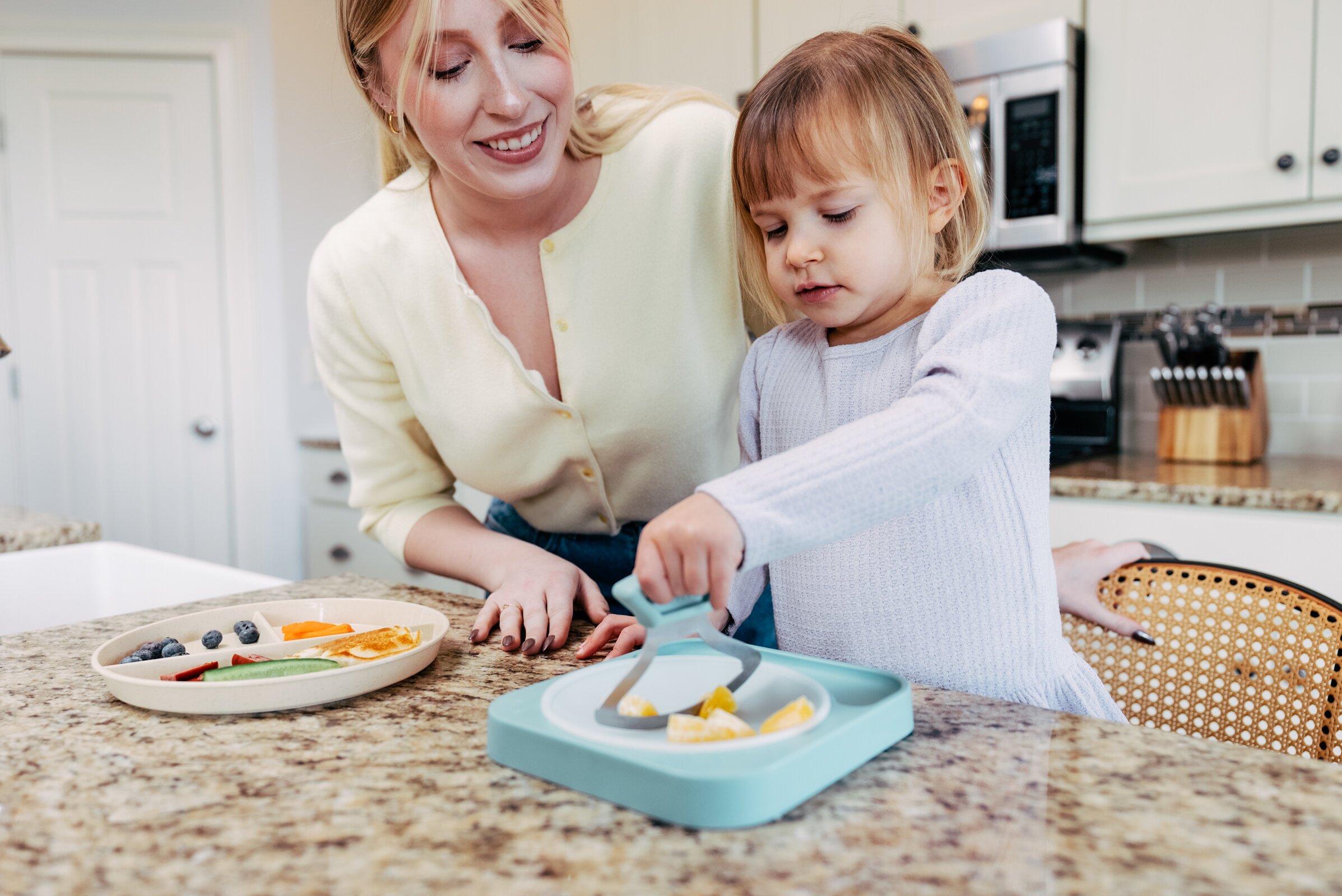 The dull-blade version of Totchop allows children to safely participate in meal prep.