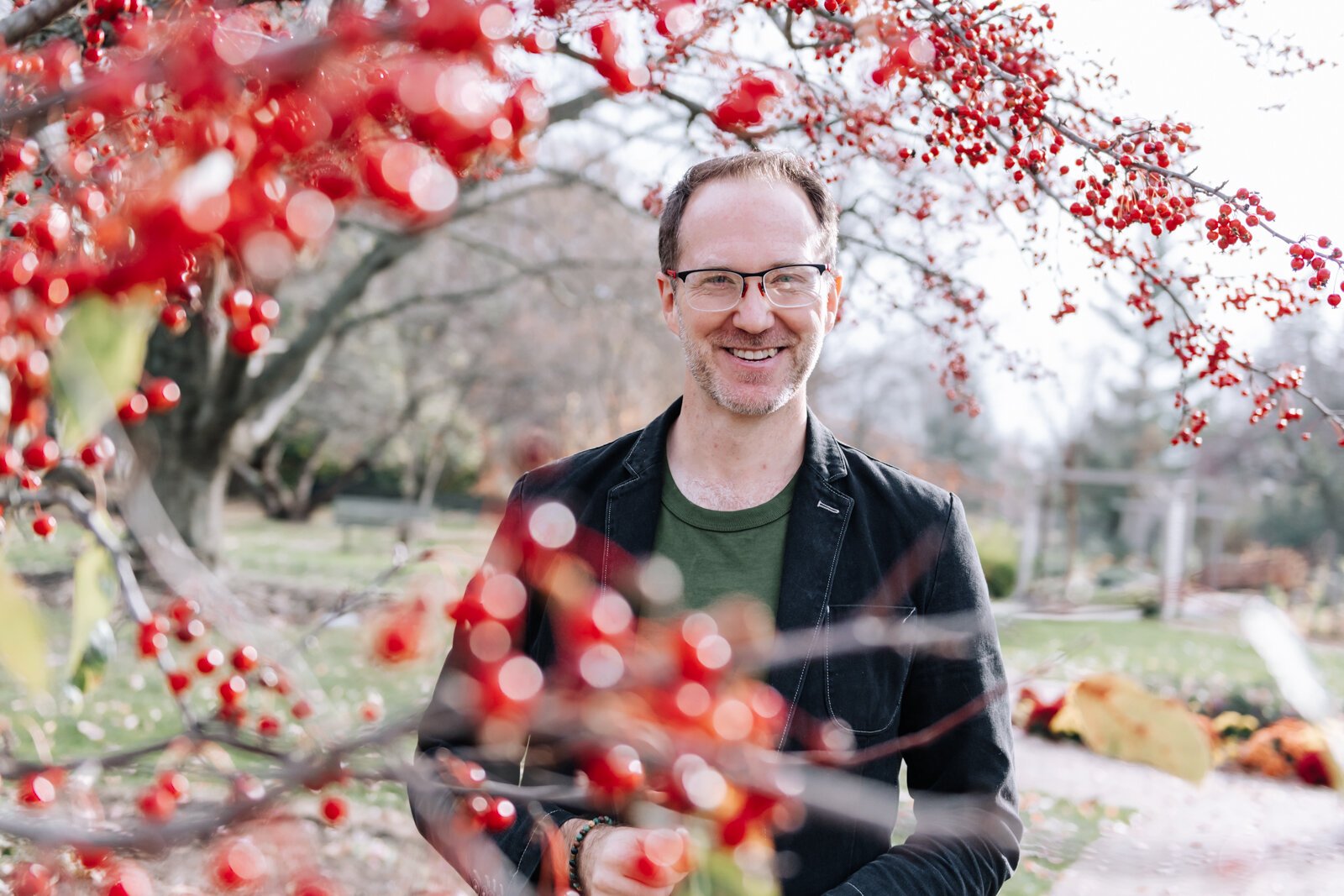 Michael Hoag forages for edible plants and fruit including crab apples at Foster Park in Fort Wayne.