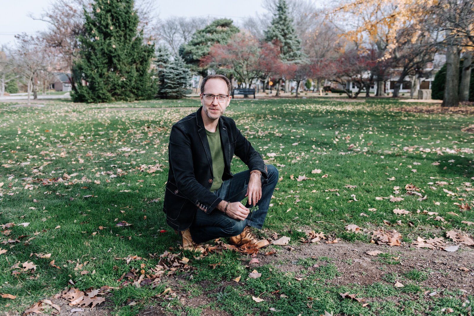 Michael Hoag forages for edible plants and fruit including chickweed at Foster Park in Fort Wayne.