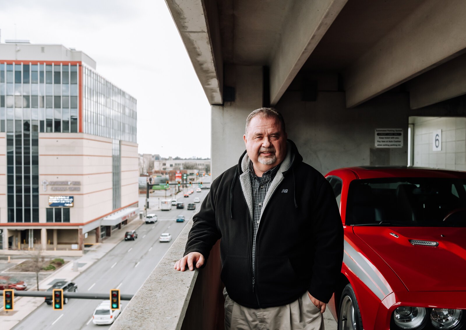 The City of Fort Wayne’s Historic Preservation Planner Creager Smith on top of the Town Center parking garage at the corner of Clinton and E. Wayne St.