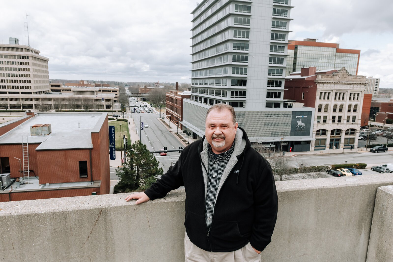 The City of Fort Wayne’s Historic Preservation Planner Creager Smith on top of the Town Center parking garage at the corner of Clinton and E. Wayne St.