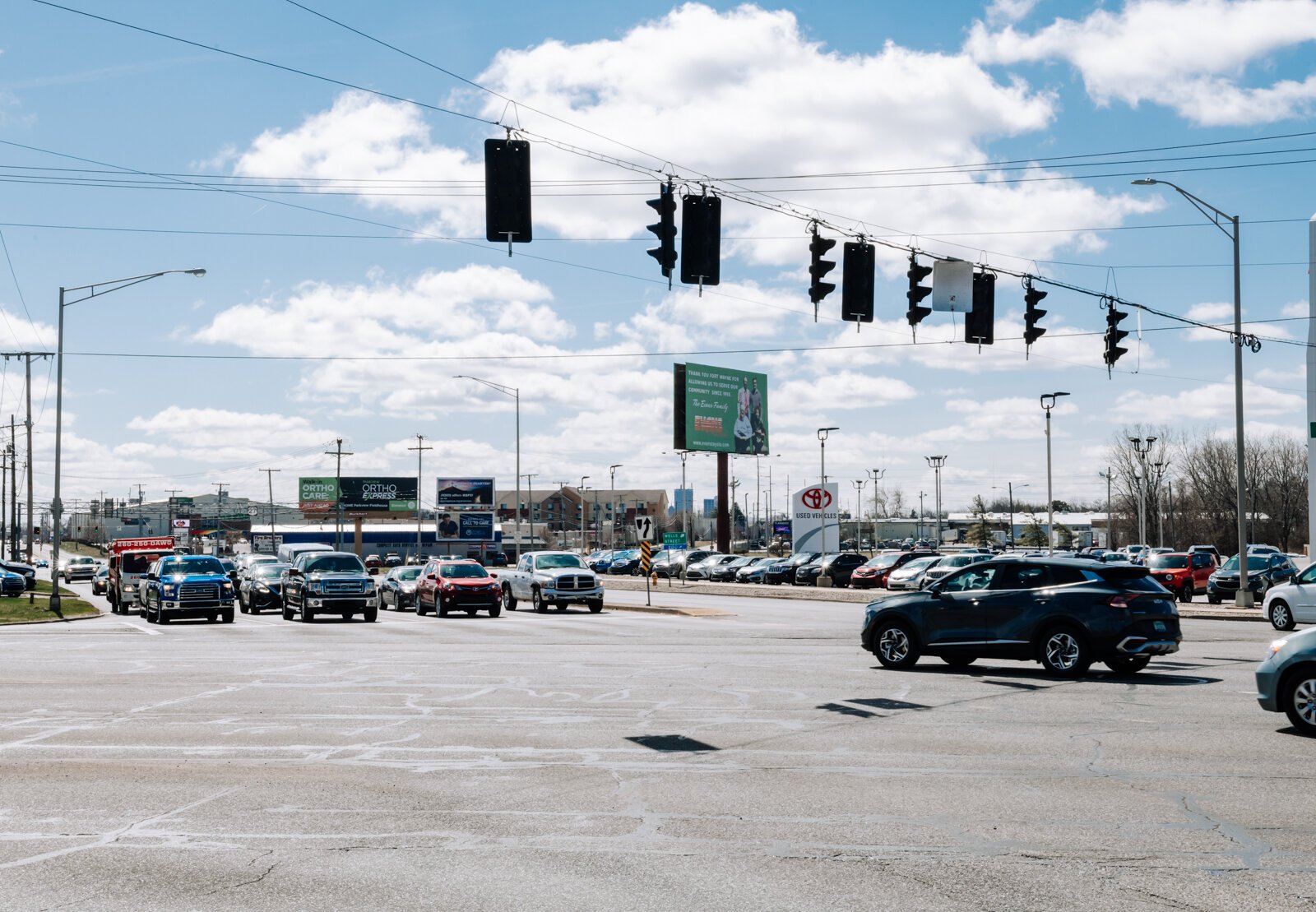 Cars pass by at the corner of IN-930 & US-27.