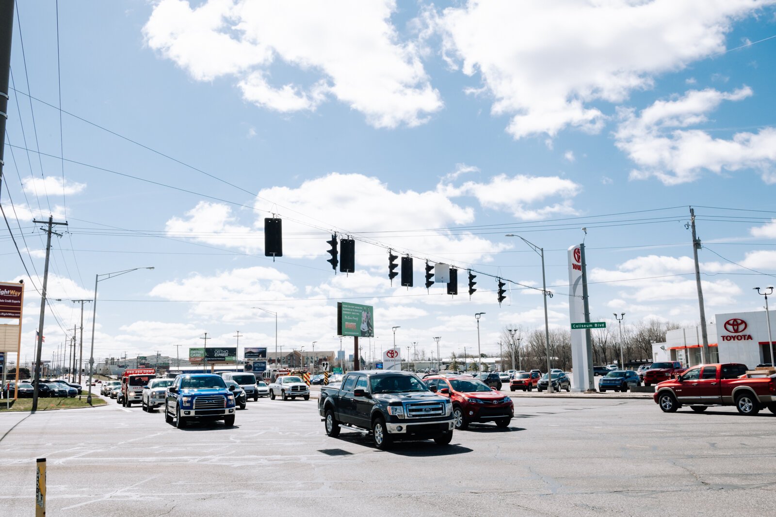 Cars pass by at the corner of IN-930 & US-27.