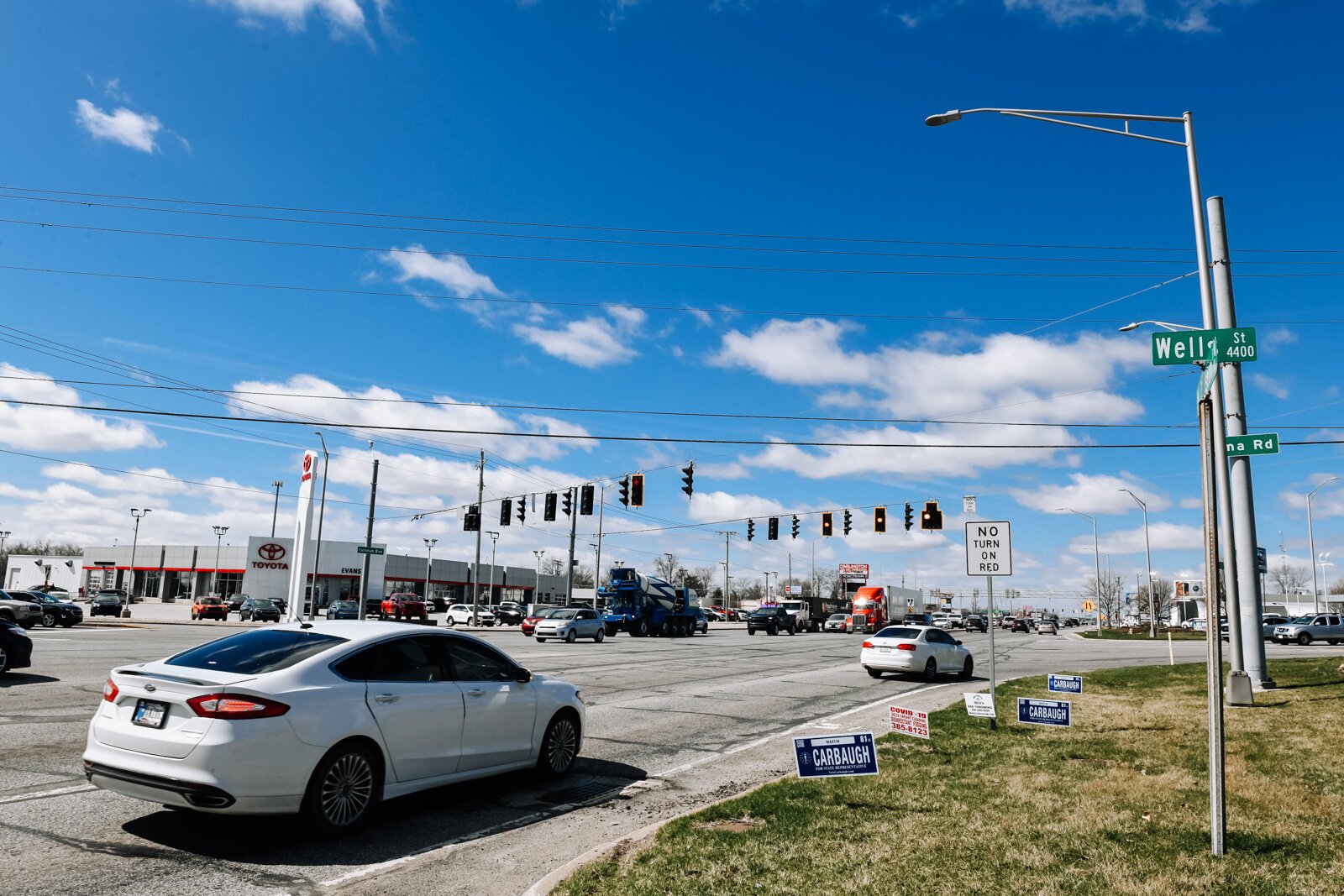 Cars pass by at the corner of IN-930 & US-27.