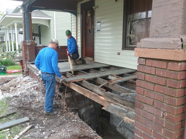 A volunteer crew with NeighborLink helped rebuild Kathleen Caudill's porch to meet city code.