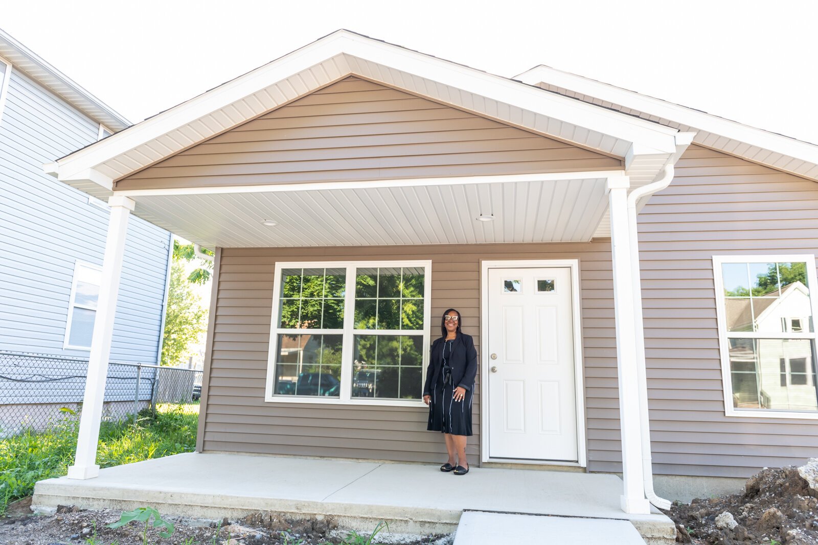 Sharon Tucker, Executive Director of Vincent Village, shows off the newest built family house in the village on July 19, 2022.