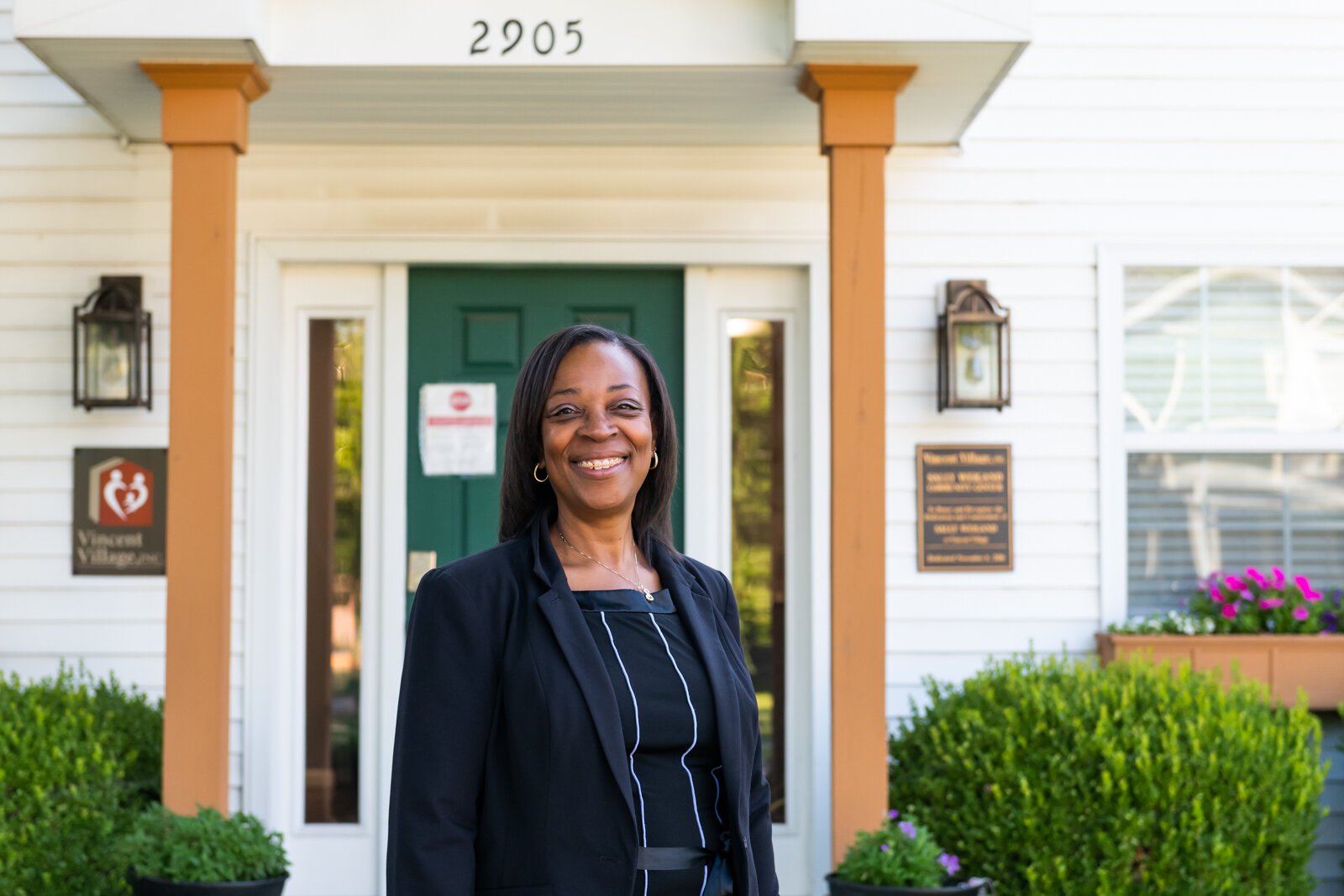 Sharon Tucker, Executive Director of Vincent Village, in front of the Sally Weigand Community Center.