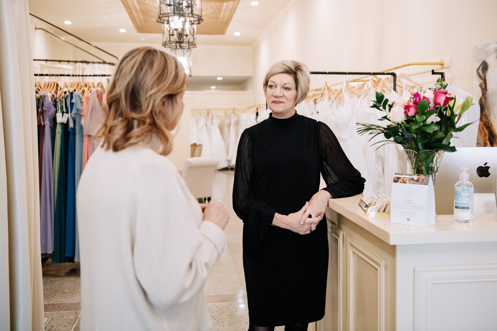 Lisa Downs, owner of Ellen's Bridal & Dress Boutique, talks with a bride's mother during an appointment.
