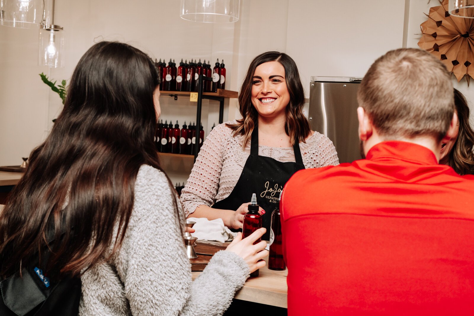 Abby Ward helps customers at JoJo's OlFactory Co.