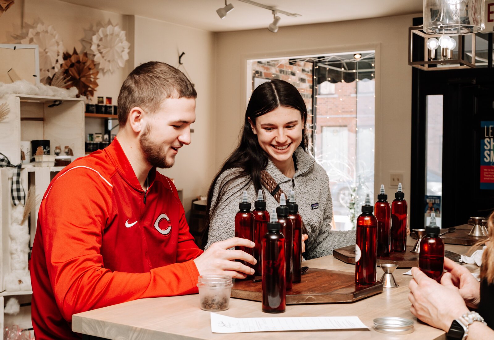 Customers Jackson Brough, left, and Avery Fowler work together to mix scents at JoJo's OlFactory Co., 36 W Canal St, Wabash, IN 46992