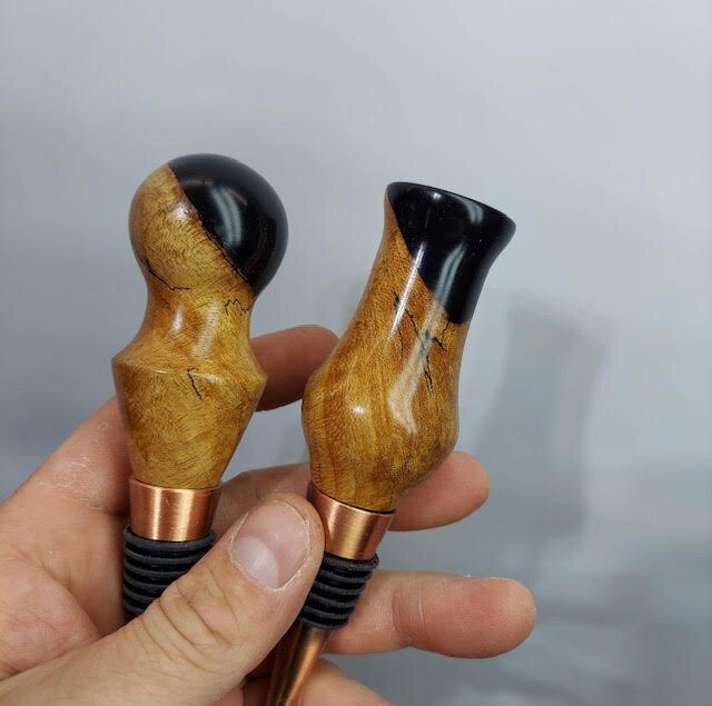 Wood wine stoppers by Fort Wayne Industrial Revolution.