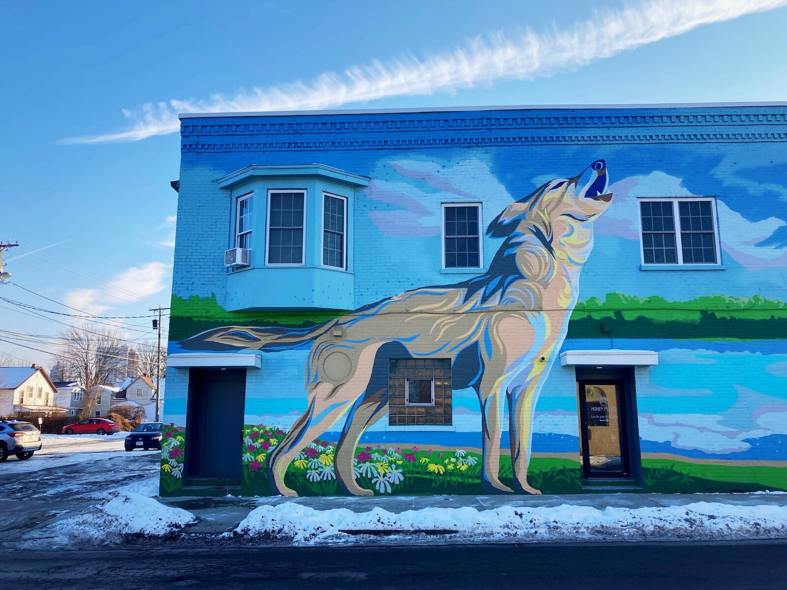 A wolf and fox mural by Tobias Studios on the side of the former Linda Lou’s furniture building at 1434 and 1436 Wells St.
